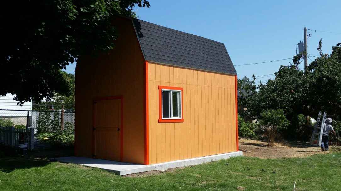 A vibrant orange custom shed with 10-foot walls, perfect for added storage and functionality.